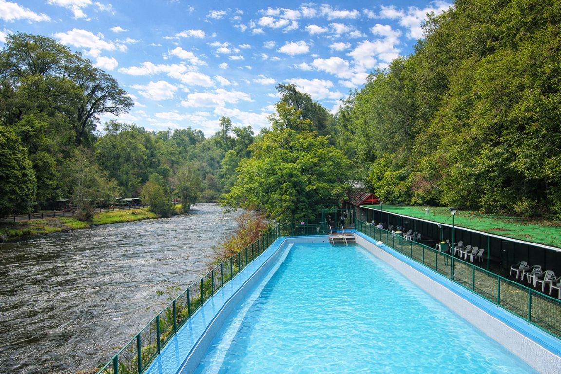 Scenic Aguas Calientes thermal pools with river views during a relaxation stop on an Atacama Chile Tours itinerary