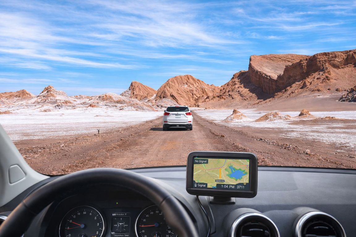 Exploring the Atacama Desert by car with GPS navigation during a guided tour organized by Atacama Chile Tours